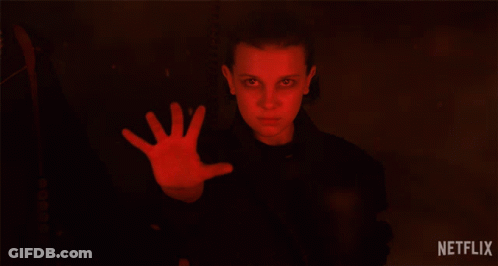 A Netflix Ad Shows A Girl With A Red Hand Reaching Out GIF