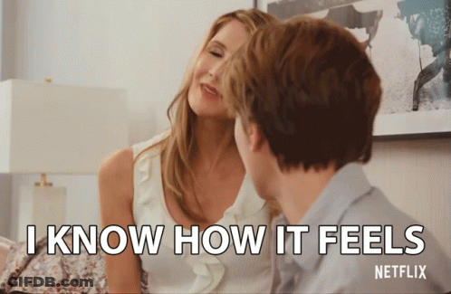 A Netflix Ad Shows A Man And A Woman Looking At Each Other GIF
