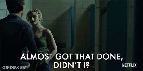 A Netflix Ad Shows A Man And Woman Standing In A Bathroom GIF