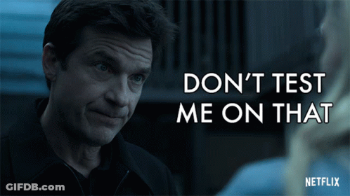 A Netflix Ad Shows A Man Talking To A Woman And Says " Don 'T Test Me On That " GIF