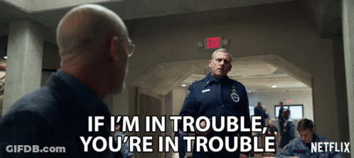 A Netflix Ad Shows A Man Talking To Another Man GIF