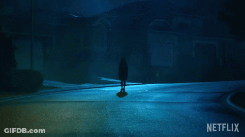 A Netflix Ad Shows A Silhouette Of A Person Standing In The Dark GIF