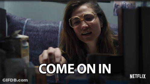 A Netflix Ad Shows A Woman Pointing At Something GIF