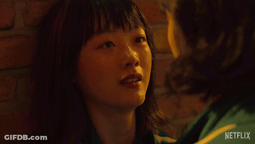 A Netflix Ad Shows A Woman Smiling And The Words Go To Jeju Island GIF
