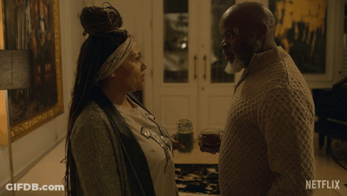 A Netflix Ad Shows A Woman Walking Down Stairs GIF