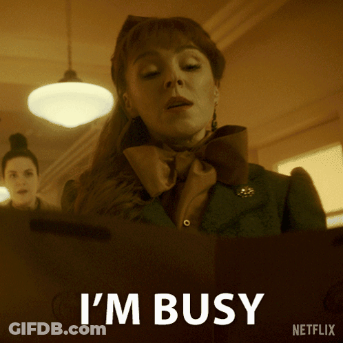 A Netflix Ad Shows A Woman With A Bow Tie And The Words I 'M Busy GIF