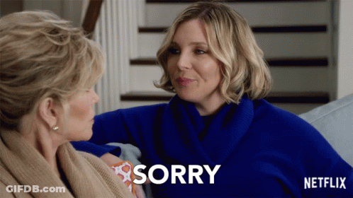 A Netflix Ad Shows Two Women Sitting On A Couch And One Says Sorry GIF