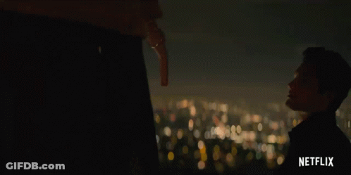A Netflix Advertisement Shows A Man Holding A Key GIF