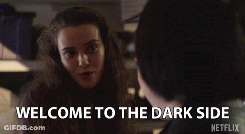 A Netflix Advertisement Shows A Woman Smiling And Says Welcome To The Dark Side GIF