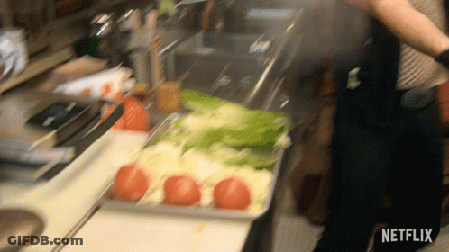 A Netflix Logo Can Be Seen In The Corner Of A Kitchen Scene GIF