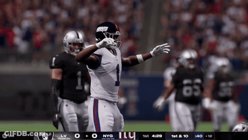 A New York Giants Player Stands On The Field GIF