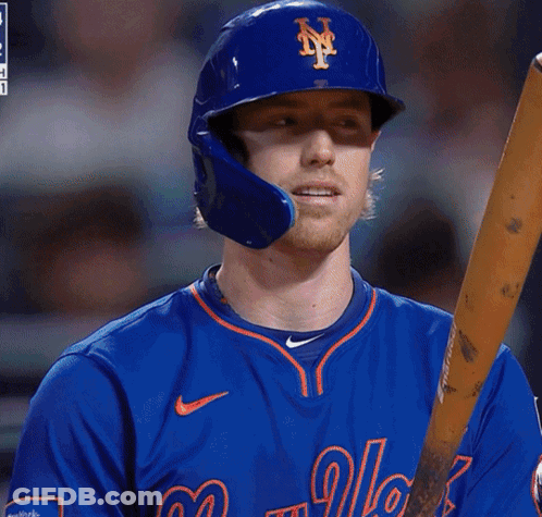 A New York Mets Baseball Player Holds A Bat GIF