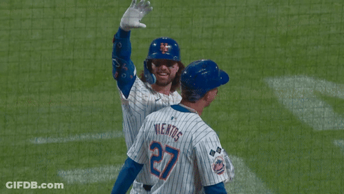 A New York Mets Baseball Player Is Waving His Hand GIF