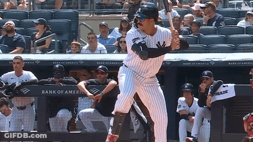 A New York Yankees Baseball Player Getting Ready To Swing At A Pitch GIF