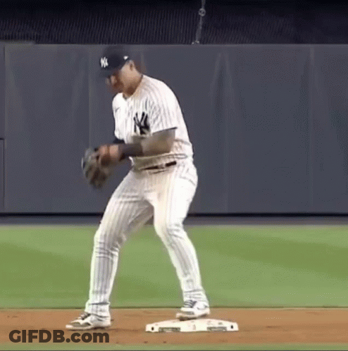 A New York Yankees Baseball Player Is Getting Ready To Catch A Ball GIF
