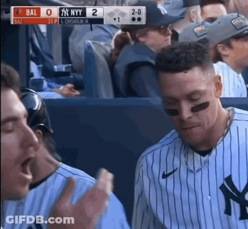 A New York Yankees Baseball Player Is Sitting In The Dugout GIF
