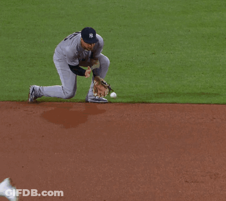 A New York Yankees Baseball Player Reaches For The Ball GIF