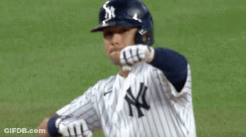 A New York Yankees Baseball Player Wears A Helmet With The Ny Logo On It GIF