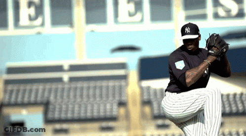 A New York Yankees Pitcher Prepares To Throw A Ball GIF