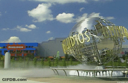 A Nickelodeon Building With A Globe In Front GIF