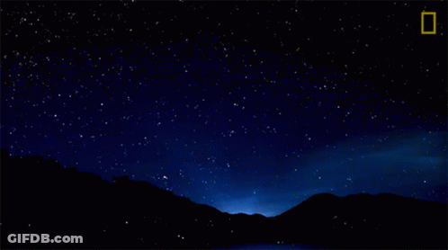A Night Sky With A Shooting Star And A National Geographic Logo GIF