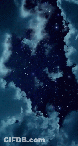 A Night Sky With Lots Of Stars And Clouds In It GIF