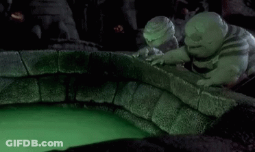 A Nightmare Before Christmas Scene With A Glowing Ball In The Middle Of A Pool Of Green Liquid . GIF