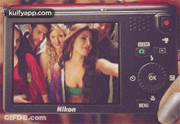 A Nikon Camera Shows A Group Of People Posing For A Picture GIF