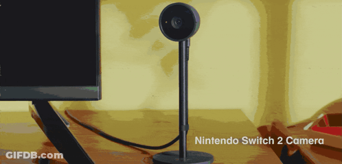 A Nintendo Switch 2 Camera Sits On A Desk Next To A Monitor GIF