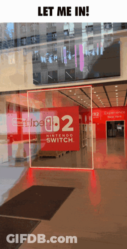 A Nintendo Switch Store In New York With A Sign That Says " Let Me In " GIF