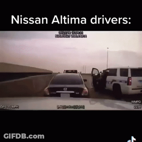 A Nissan Altima Is Driving Down A Highway Next To A Police Truck GIF