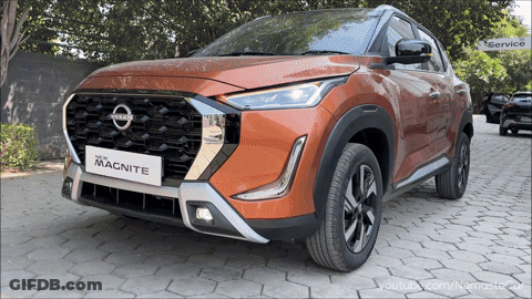 A Nissan Magnite Is Parked On A Brick Pavement GIF