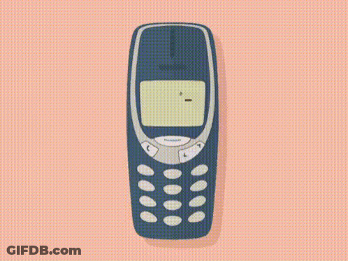 A Nokia Cell Phone Is Playing A Game Of Snake On A Pink Background . GIF