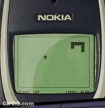 A Nokia Phone Playing A Game With A Snake On The Screen GIF