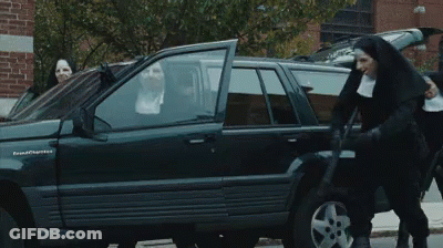 A Nun Is Getting Out Of A Black Grand Cherokee Suv GIF