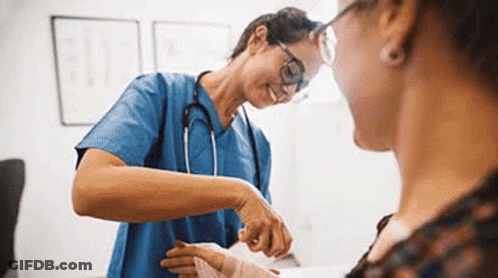 A Nurse Is Putting A Bandage On A Patient 'S Wrist . GIF