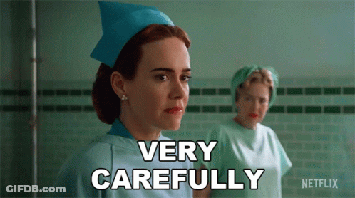 A Nurse Says " Very Carefully " While Another Nurse Looks On GIF