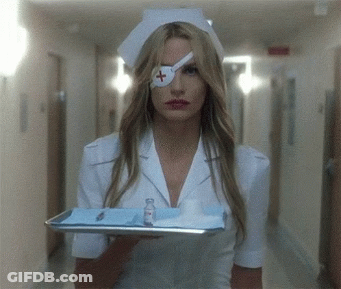 A Nurse With A Bandage On Her Eye Is Holding A Tray Of Supplies GIF