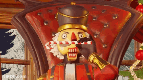 A Nutcracker Is Sitting In A Chair Holding A Candy Cane . GIF