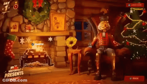 A Nutcracker Is Sitting In Front Of A Fireplace With A Christmas Tree . GIF