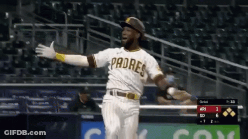 A Padres Baseball Player Is Running Towards Home Plate . GIF