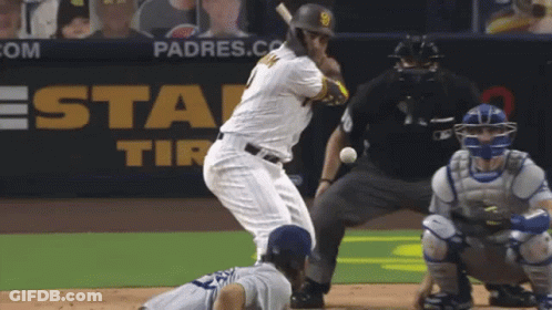 A Padres Baseball Player Is Swinging At A Ball GIF