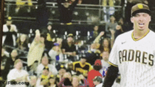 A Padres Baseball Player Stands In Front Of A Crowd Of People GIF