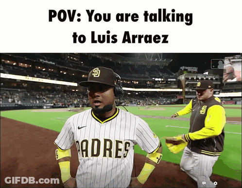 A Padres Baseball Player Talking To Luis Arraez On The Field GIF