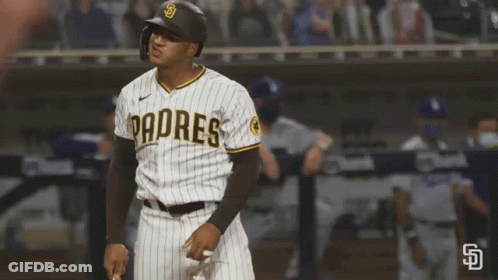 A Padres Baseball Player Wearing A Helmet Stands On The Field GIF