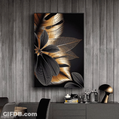 A Painting Of A Black And Gold Flower Hangs On A Wall GIF