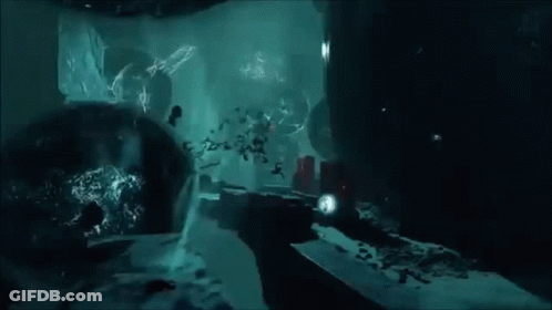 A Painting Of A Cave With A Lot Of Rocks GIF