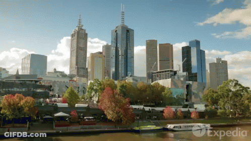 A Painting Of A City Skyline With The Word Expedia On The Bottom GIF