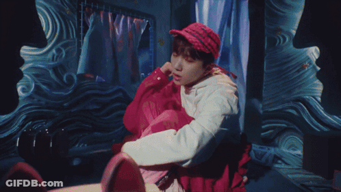 A Painting Of A Man Holding A Yellow Umbrella On A Television Screen GIF