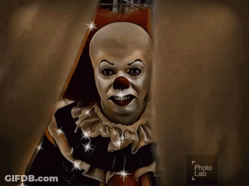 A Painting Of A Scary Clown Is Displayed On A Photo Lab Page GIF